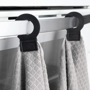 hook and hang towel displayed on oven door handle in kitchen